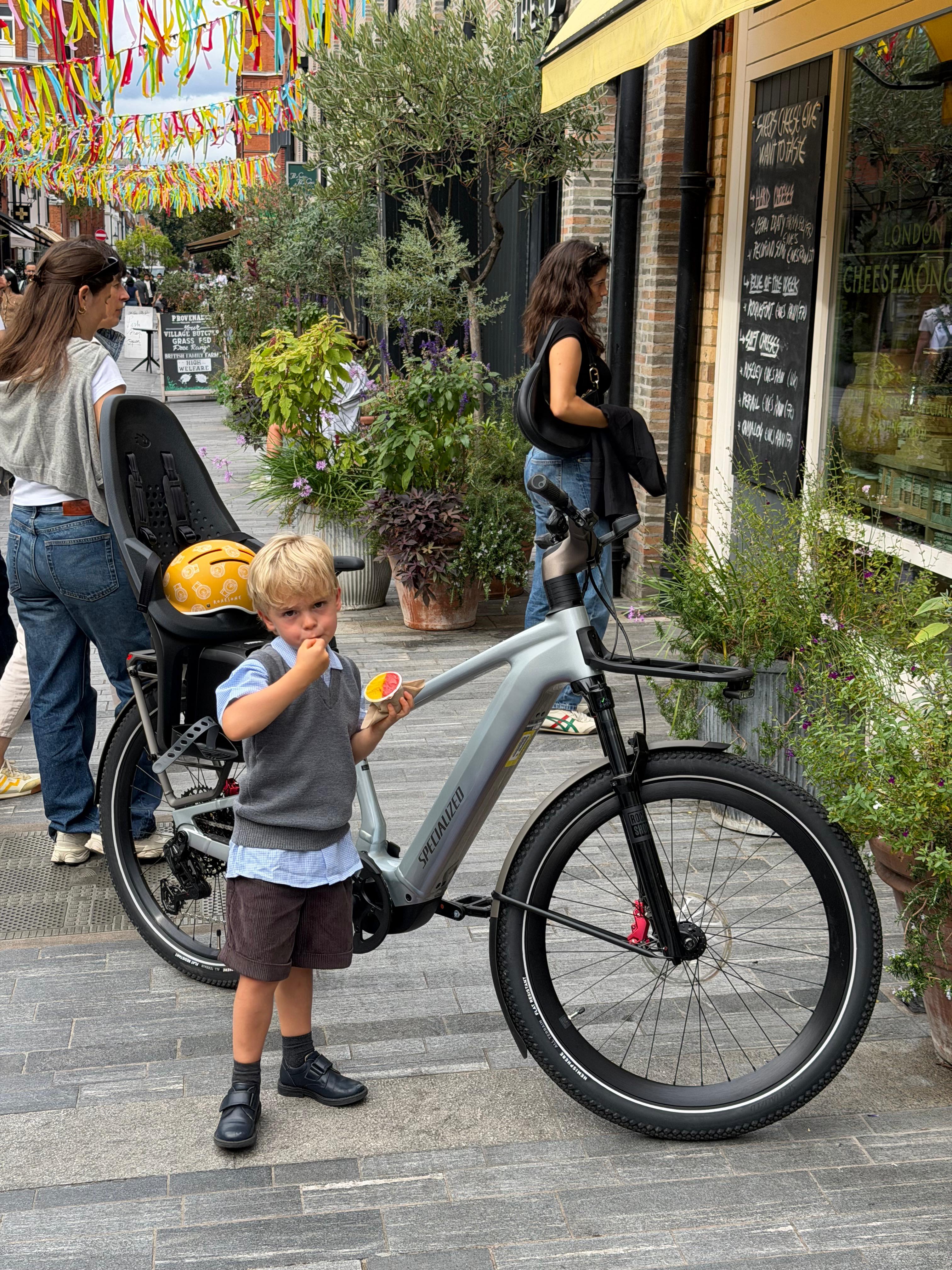 Leo beside the family bicycle after school